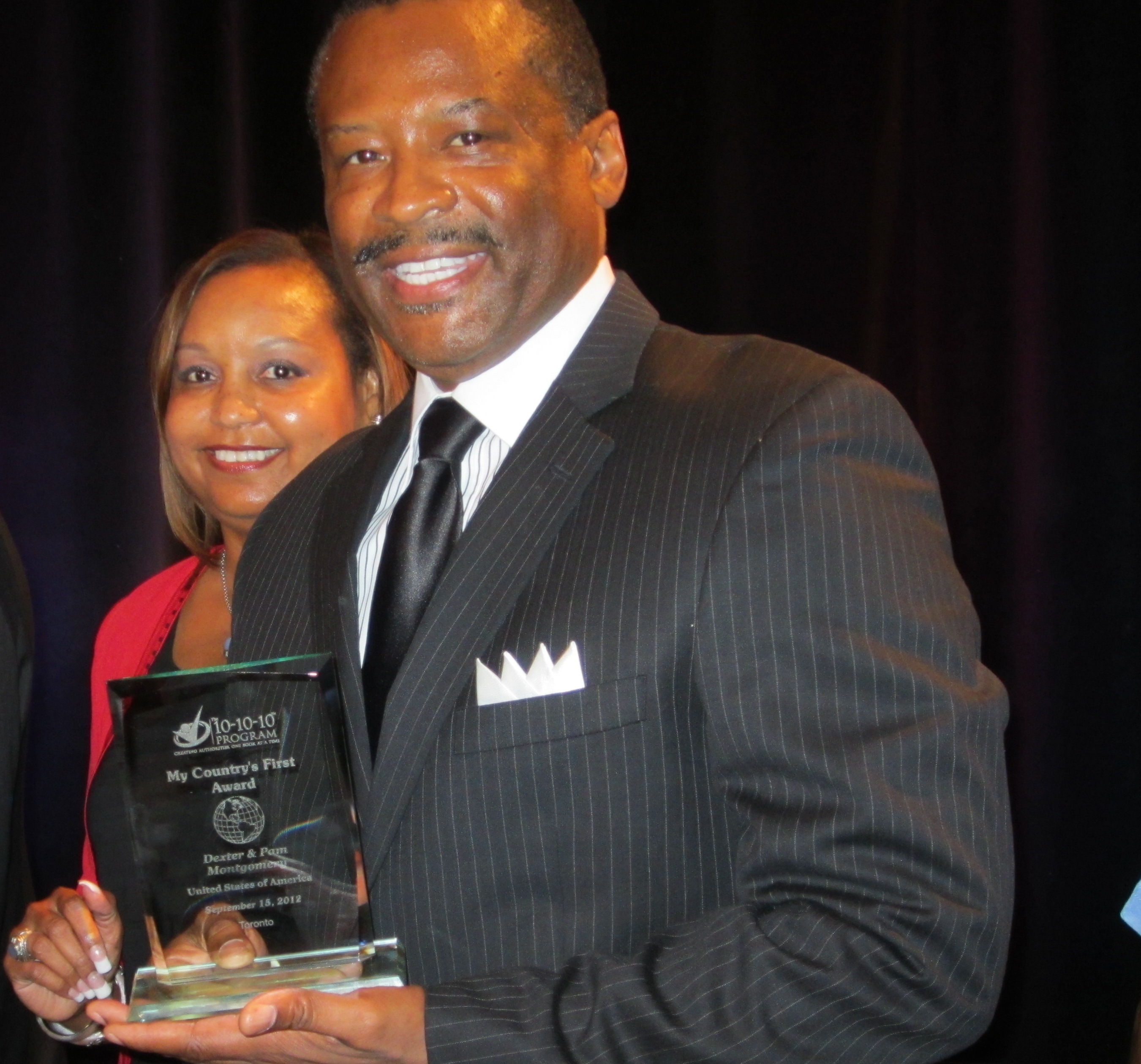 Dexter and Pamela Montgomery receive award for "The Book on Investing" at the Ultimate Author Bootcamp in Toronto, Canada.